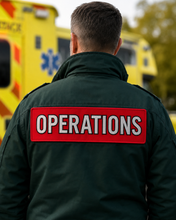 Load image into Gallery viewer, Large red back panel patch reading Operations on the rear of a dark green emergency services jacket