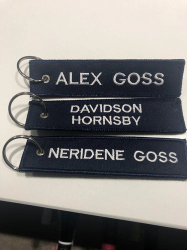 Custom embroidered key ring patch 130mm x 30mm in Navy and white .